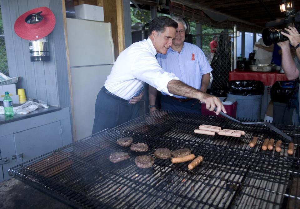 <span class="caption">Just a regular American guy grilling regular American food.</span> <span class="attribution"><a class="link " href="https://www.gettyimages.com/detail/news-photo/mitt-romney-l-the-republican-presidential-hopeful-and-news-photo/593352876" rel="nofollow noopener" target="_blank" data-ylk="slk:Rick Friedman/Corbis via Getty Images;elm:context_link;itc:0;sec:content-canvas">Rick Friedman/Corbis via Getty Images</a></span>