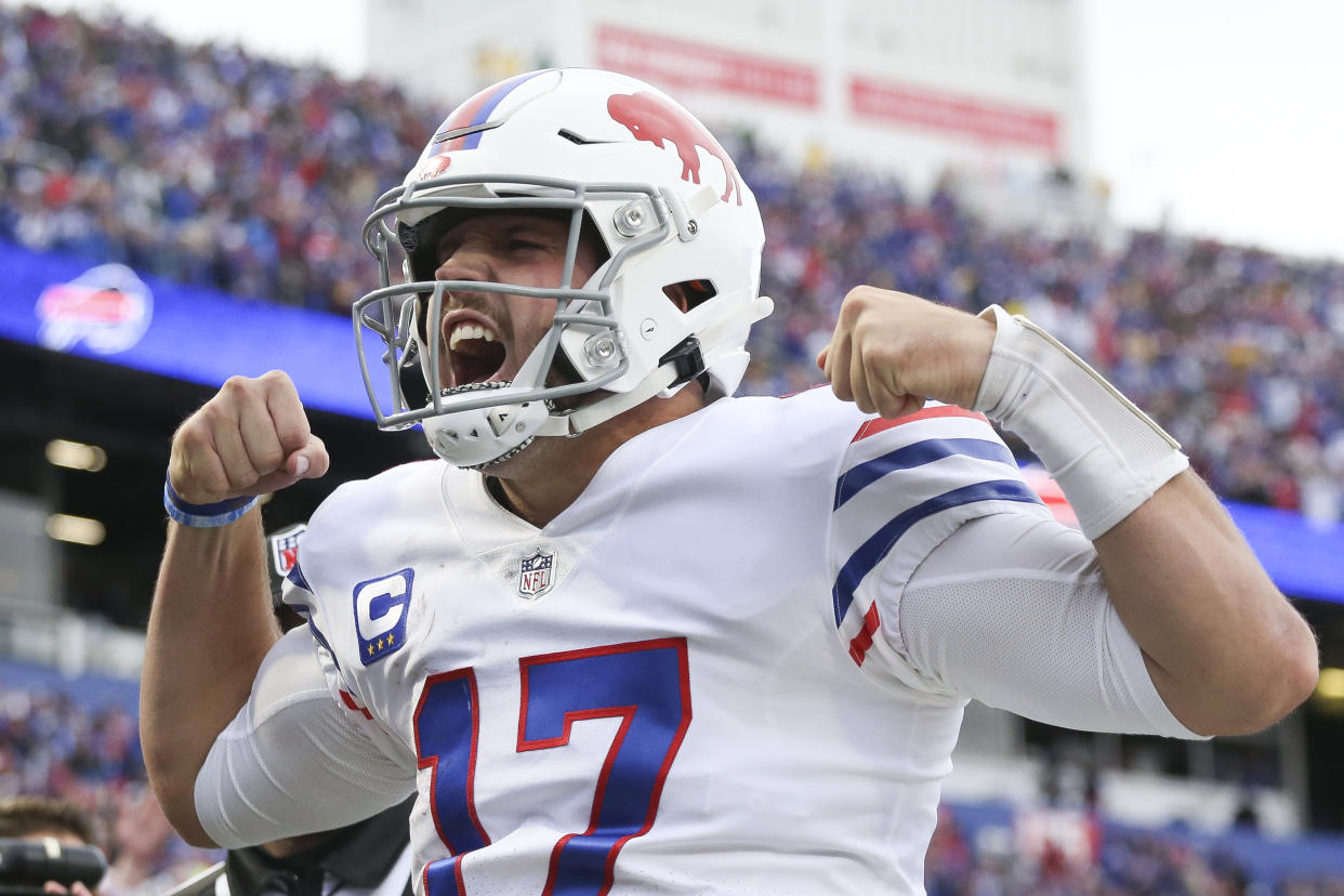 ORCHARD PARK, NEW YORK - OCTOBER 31: Josh Allen #17 of the Buffalo Bills celebrates after a touchdown run during the fourth quarter against the Miami Dolphins at Highmark Stadium on October 31, 2021 in Orchard Park, New York. (Photo by Joshua Bessex/Getty Images)