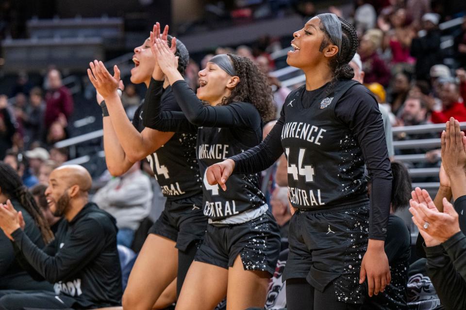 Lawrence Central High School players celebrate during the second half of an IHSAA class 4A girls’ basketball state finals game against Lake Central high School, Saturday, Feb. 24, 2024, at Gainbridge Fieldhouse, in Indianapolis. Lawrence Central won the school’s first state championship title in girl’s basketball.