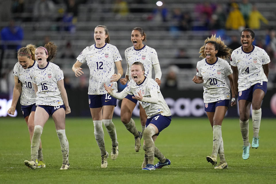 Players for the United States celebrate during the penalty shootout in a CONCACAF Gold Cup women's soccer tournament semifinal match against Canada, Wednesday, March 6, 2024, in San Diego. (AP Photo/Gregory Bull)