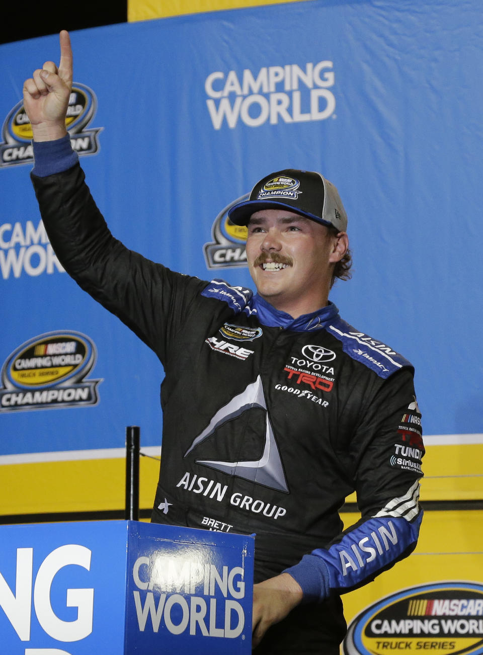 Brett Moffitt celebrates in Victory Lane after winning the NASCAR Truck Series auto racing season championship at Homestead-Miami Speedway in Homestead, Fla., Friday, Nov. 16, 2018. (AP Photo/Terry Renna)