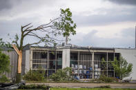 A wall is missing in a chemical plant in Paderborn, Germany, Friday, May 20, 2022. "In the course of a thunderstorm, a whirlwind on Friday afternoon cut a swath of devastation from west to east through the middle of Paderborn towards the eastern parts of the city," police said. (Lino Mirgeler/dpa via AP)