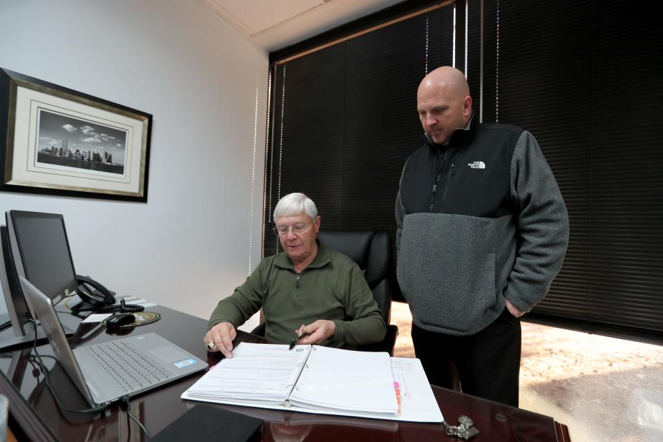 Detective Dennis Malott goes over information in a cold case file with Lt. Zachary Burdette in their office on Wednesday, January 17, 2024.