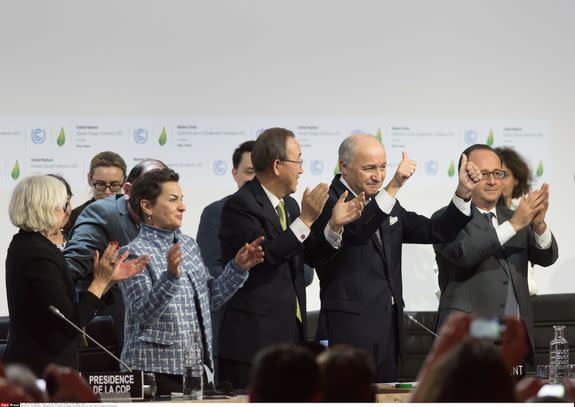 Officials celebrate the adoption of the Paris Climate Agreement in Le Bourget, France on Dec. 12, 2015.