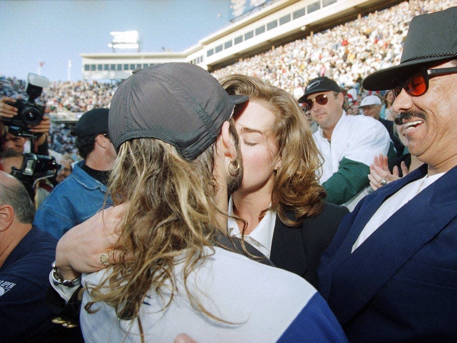 Andre Agassi kisses Brooke Shields after winning the U.S. Open men’s finals championship in New York, on September 11, 1994