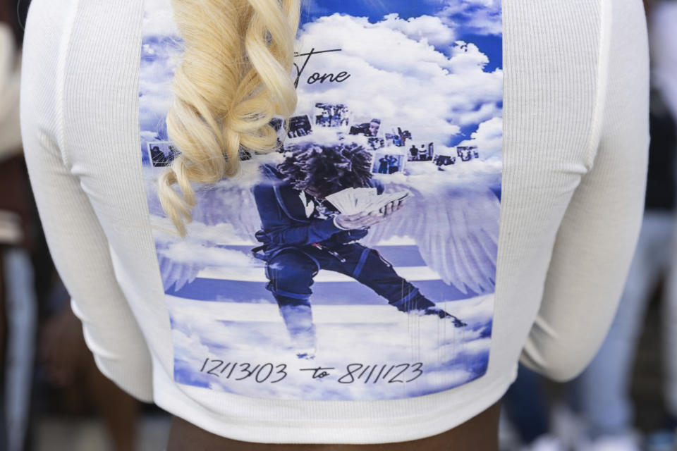 Antonio Lee's girlfriend attends a vigil for Lee, Friday, Aug. 18, 2023, in Baltimore. Lee, 19, was shot and killed while squeegeeing in Baltimore. (AP Photo/Julia Nikhinson)