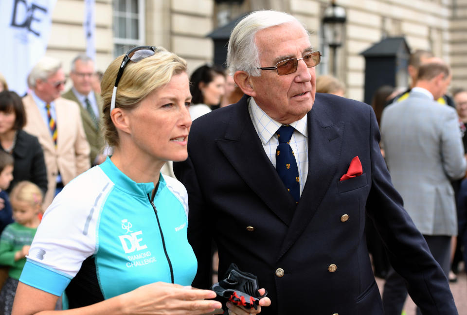 LONDON, ENGLAND - SEPTEMBER 25:  Sophie, Countess of Wessex stands beside her father Christopher Rhys-Jones in the forecourt of Buckingham Palace after receiving her Diamond Award for biking from Edinburgh to London in support of The Duke of Edinburgh's Award on September 25, 2016 in London, England.  The Countess and the other riders were presented with a Diamond Pin to mark the completion of the Diamond Challenge. The Countess of Wessex cycled 445 miles from the Palace of Holyroodhouse, Edinburgh to Buckingham Palace, London over seven days as her 'Diamond Challenge' - a special initiative marking the 60th anniversary of the Duke of Edinburgh's Award. (Photo by Anwar Hussein/WireImage)
