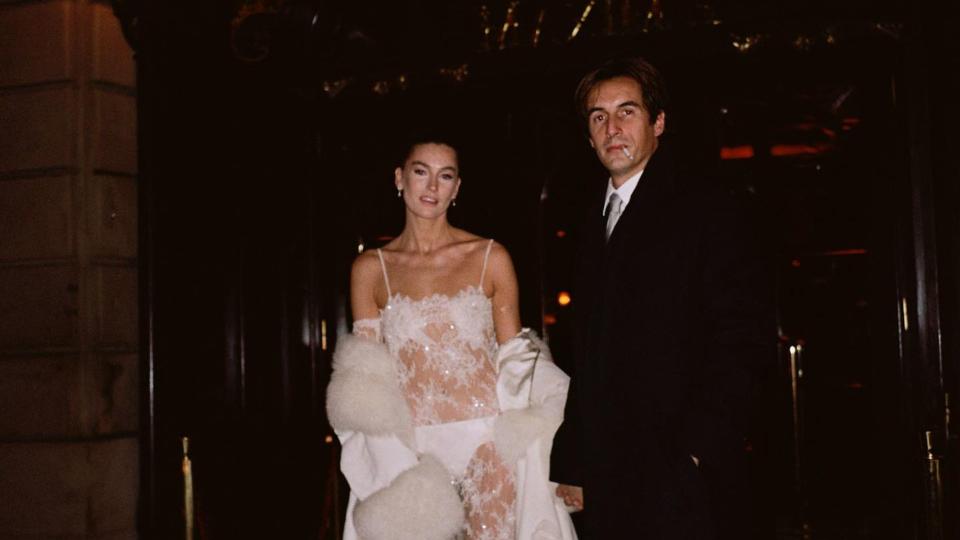 Camille Charriereon her wedding day wearing a lace white dress with visible white knickers