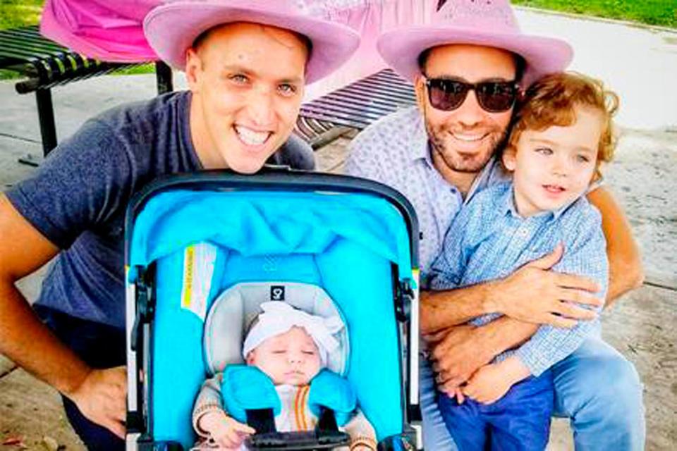 This undated photo provided by Immigration Equality shows Roee, left, and Adiel Kiviti, right, with their children newborn, Kessem and older brother Lev. In 2019, the Maryland couple sued to challenge the State Department's refusal to recognize the U.S. citizenship of their infant daughter, who was born in Canada to a surrogate mother.