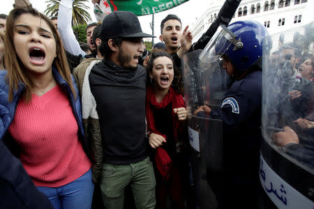 Police stand guard as students protest against President Abdelaziz Bouteflika's plan to extend his 20-year rule by seeking a fifth term in Algiers, Algeria February 26, 2019. REUTERS/Ramzi Boudina