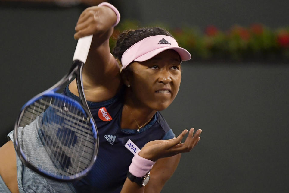 Naomi Osaka, of Japan, serves to Kristina Mladenovic, of France, at the BNP Paribas Open tennis tournament Saturday, March 9, 2019, in Indian Wells, Calif. (AP Photo/Mark J. Terrill)