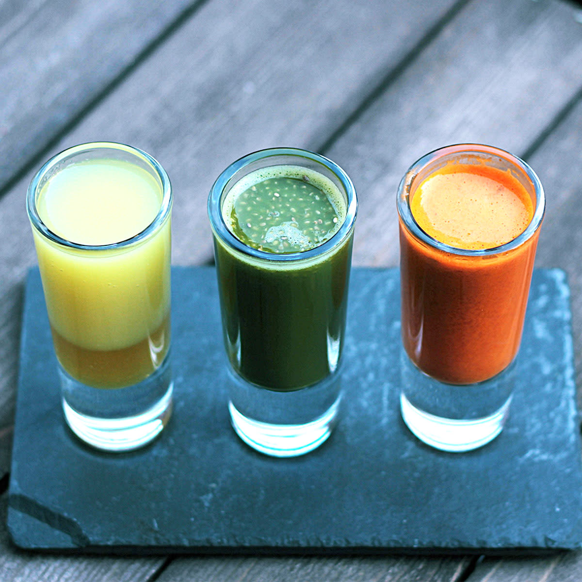 shot glasses filled with wellness juice