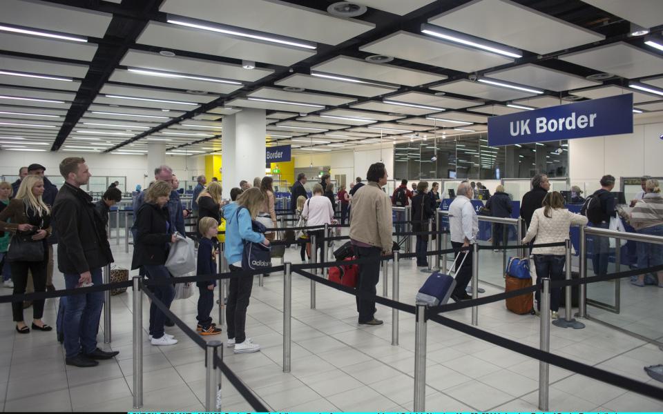 Border Force check the passports of passengers arriving at Gatwick Airport (stock picture) - Credit: Oli Scarff/Getty Images