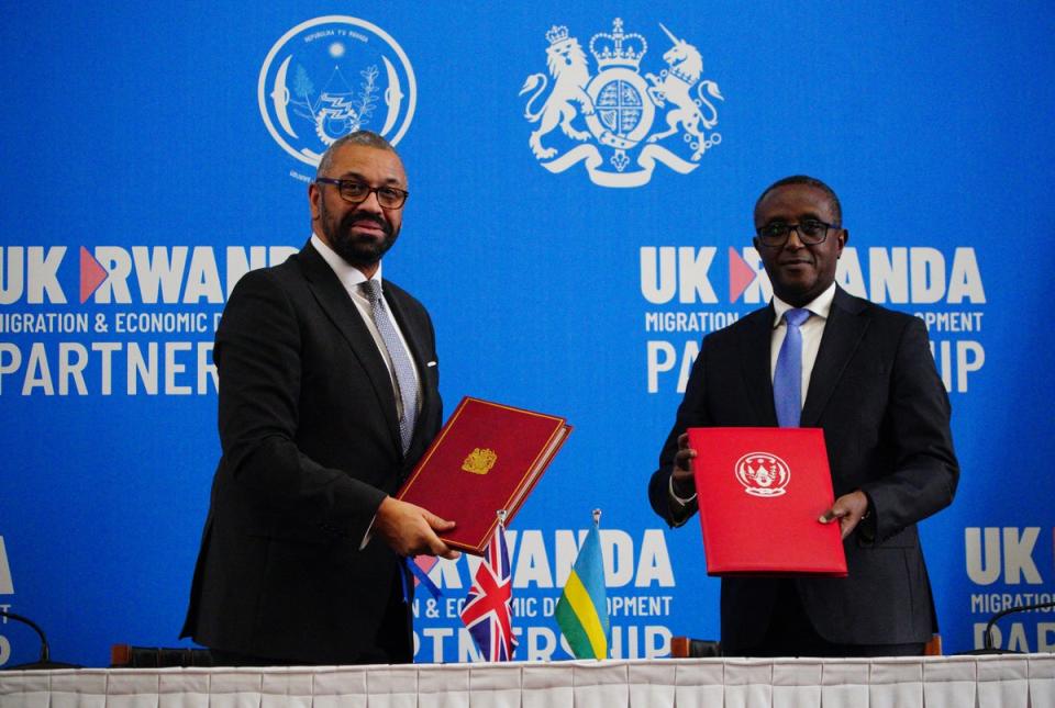 Home secretary James Cleverlyand Rwanda's foreign minister Vincent Biruta signed a new treaty in Kigali in December (POOL/AFP via Getty Images)