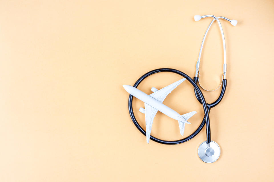 A small model of an airplane inside of an coiled stethascope