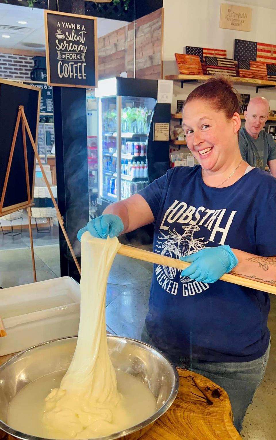 Sarah McLuckie makes her mozzarella cheese stretch a few extra inches at a cheese-making class sponsored by Butcher and Bear (Ron Tulotta) at Sunago Coffee Co. on May 28, 2023.