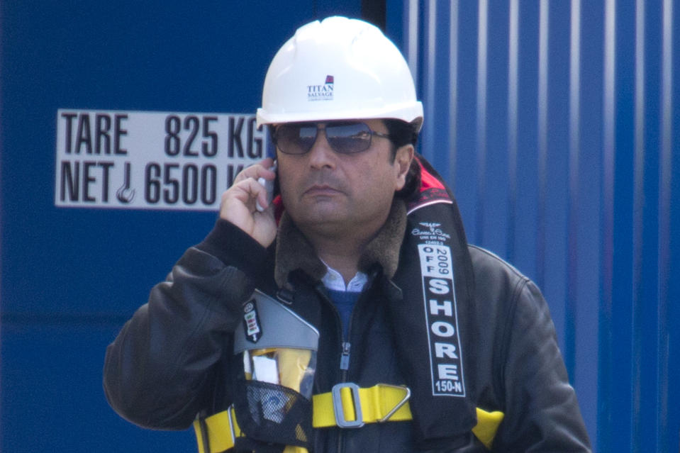 Captain Francesco Schettino talks on the phone as he waits to board the wreck of the Costa Concordia cruise ship, just off the coast of the Giglio island, Thursday, Feb. 27, 2014. The captain of the Costa Concordia has been permitted to go aboard the shipwreck for the first time since it capsized two years ago as part of a new court-ordered search. Consumer groups and lawyers for Capt. Francesco Schettino asked the court in Grosseto to authorize the searches to determine if any factors beyond human error contributed to the disaster. After searching the bridge and elevators last month, experts will examine the emergency generators Thursday. (AP Photo/Andrew Medichini)