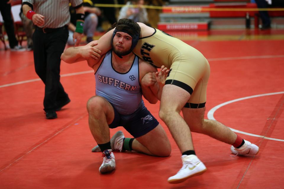 Suffern's Yiorgos Georgas and Clarkstown North's Brian Bordas wrestle in the 215-pound weight class during the Rockland County wrestling championship at Tappan Zee High School Jan. 21, 2023. 