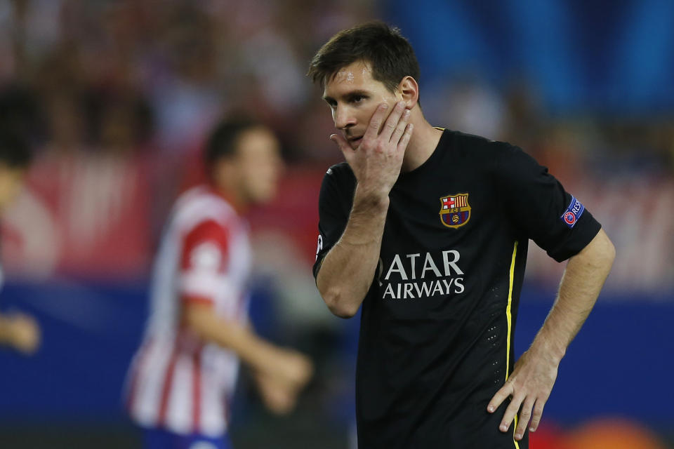 Barcelona's Lionel Messi from Argentina gestures during the Champions League quarterfinal second leg soccer match between Atletico Madrid and FC Barcelona at the Vicente Calderon stadium in Madrid, Spain, Wednesday, April 9, 2014. (AP Photo/Andres Kudacki)