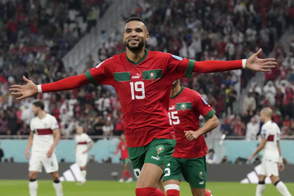 Morocco's Youssef En-Nesyri celebrates after scoring his side's first goal during the World Cup quarterfinal soccer match between Morocco and Portugal, at Al Thumama Stadium in Doha, Qatar, Saturday, Dec. 10, 2022. (AP Photo/Martin Meissner)