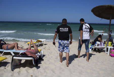 Tourist police officers patrol at the beach in Sousse, Tunisia, July 1, 2015. REUTERS/Zohra Bensemra