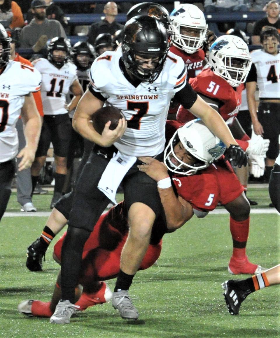 Springtown's Hudson Hulett is tackled by Hirschi's Javian Frazier on Friday, December 3, 2021 in Allen.