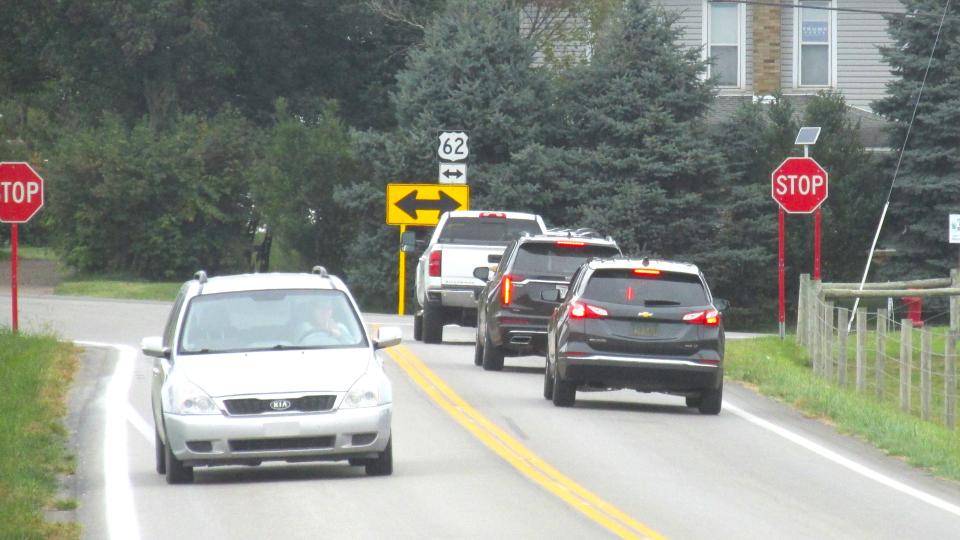 The wait to get onto state Route 39/U.S. Route 62 from state Route 557 could be eliminated with the addition of a traffic light and a turning lane, according to Holmes County commissioners.