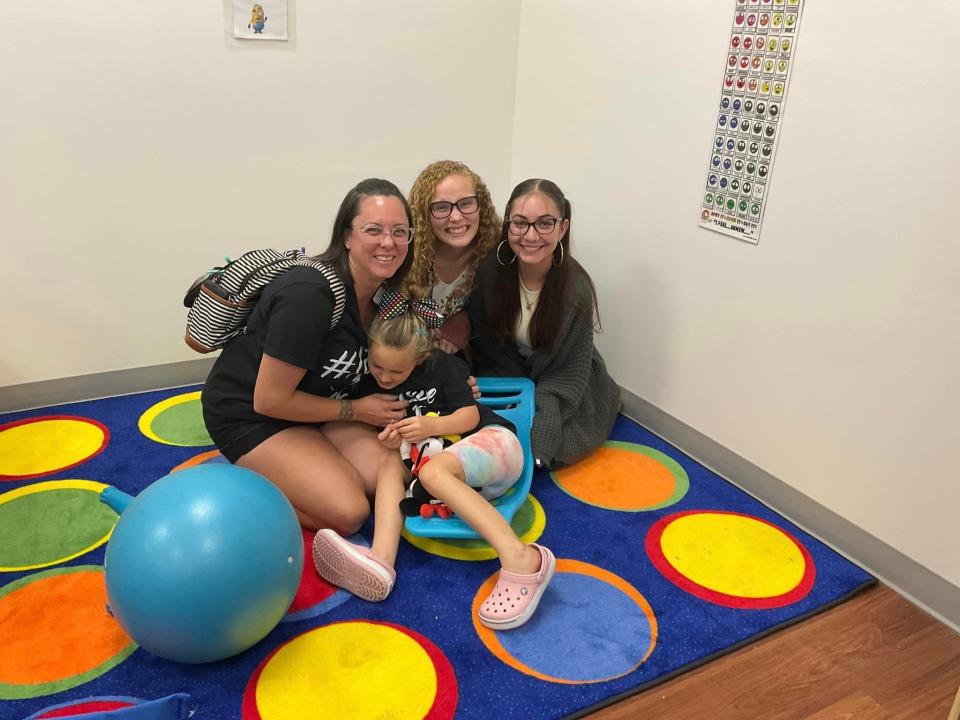 Teachers from The Learning Center welcome students in their first back-to-school day at the new Royal Palm Beach campus.