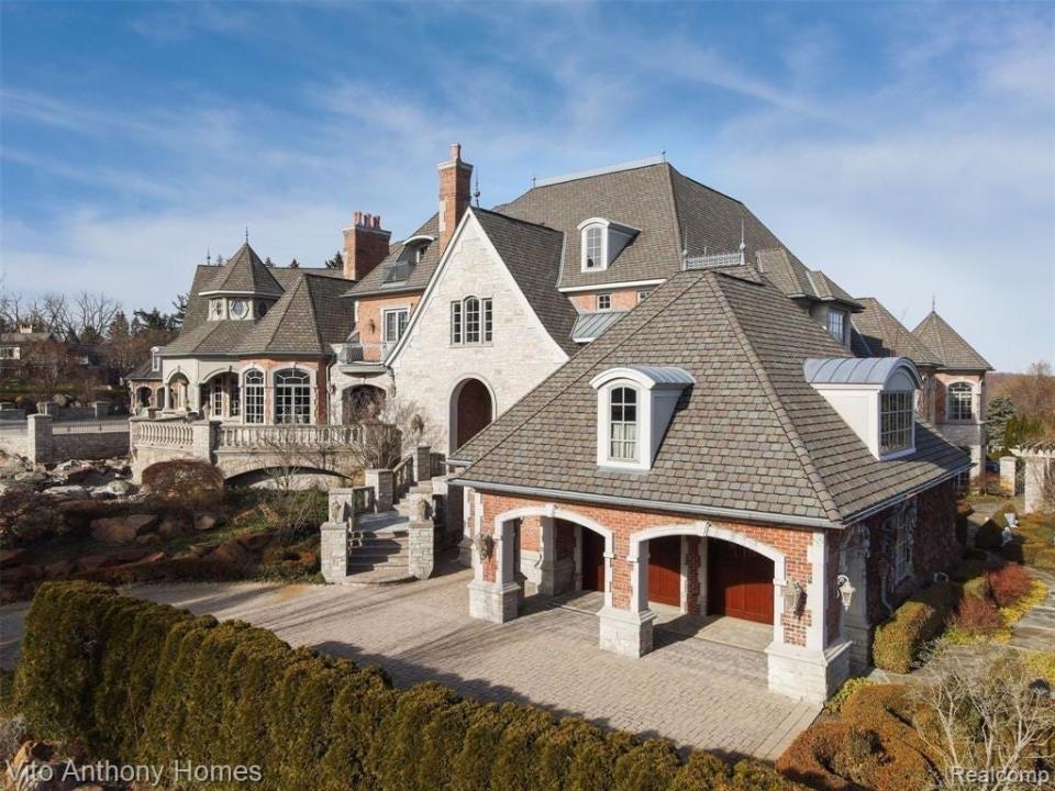 multi-story home with bushes in the foreground in Michigan