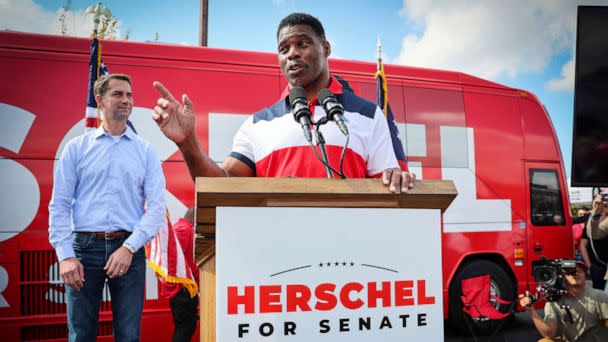 PHOTO: Herschel Walker, a Republican Senate candidate for Georgia, speaks at his 'United Georgia' campaign bus tour with Sen. Tom Cotton, in Carrollton, Ga., Oct. 11, 2022. (Arvin Temkar/Atlanta Journal-Constitution via AP)