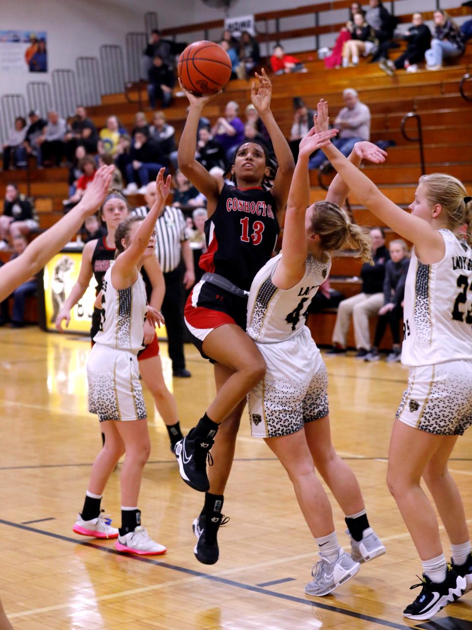 Savannah Bartlett shoots over Lily Yoder in Coshocton's game with River View. Bartlett received District 5 first-team mention, as those teams were recently released.