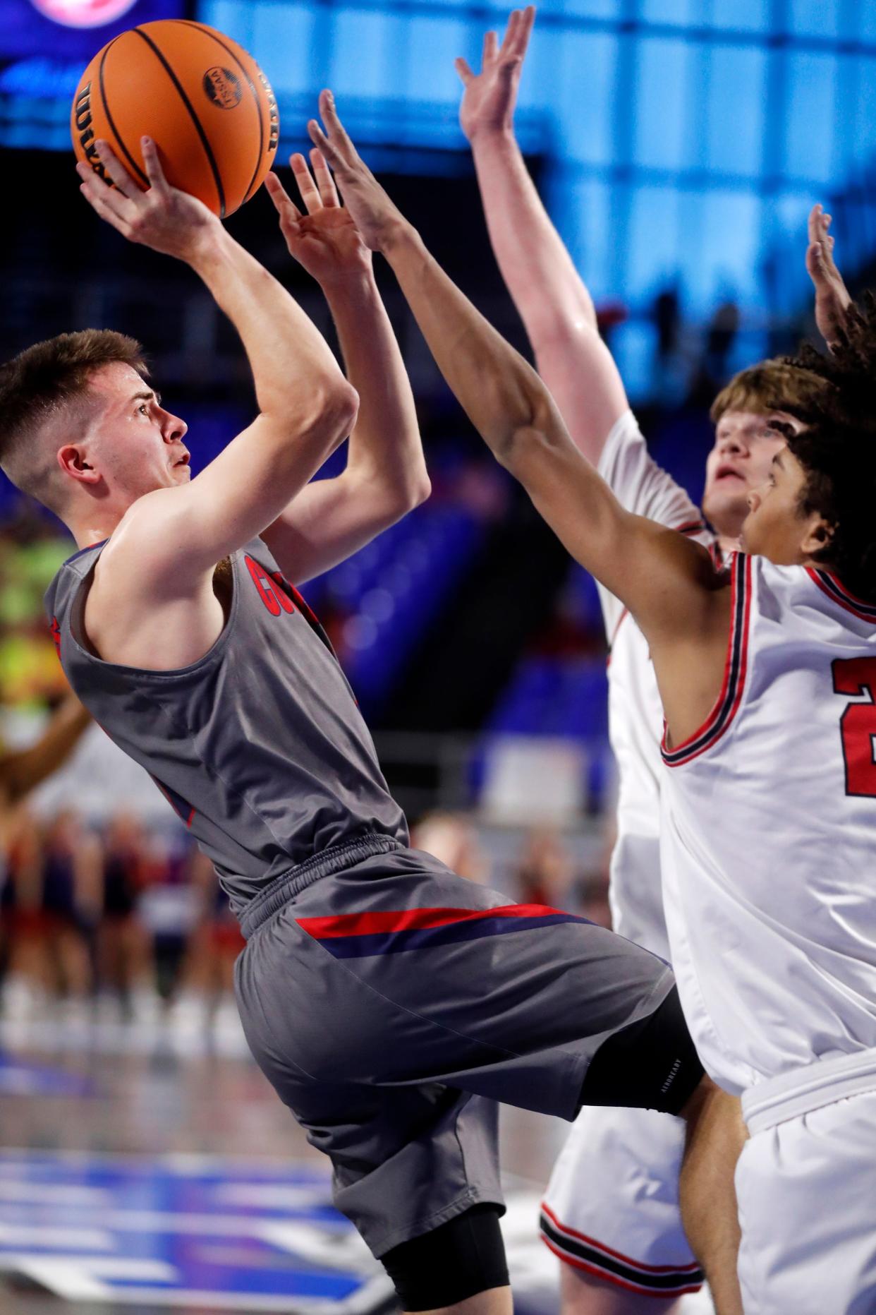 Cookeville's Collin Ayers goes up for a shot as Maryville's Brayden Hazelbaker defends during Wednesday's Class 4A state quarterfinal game.