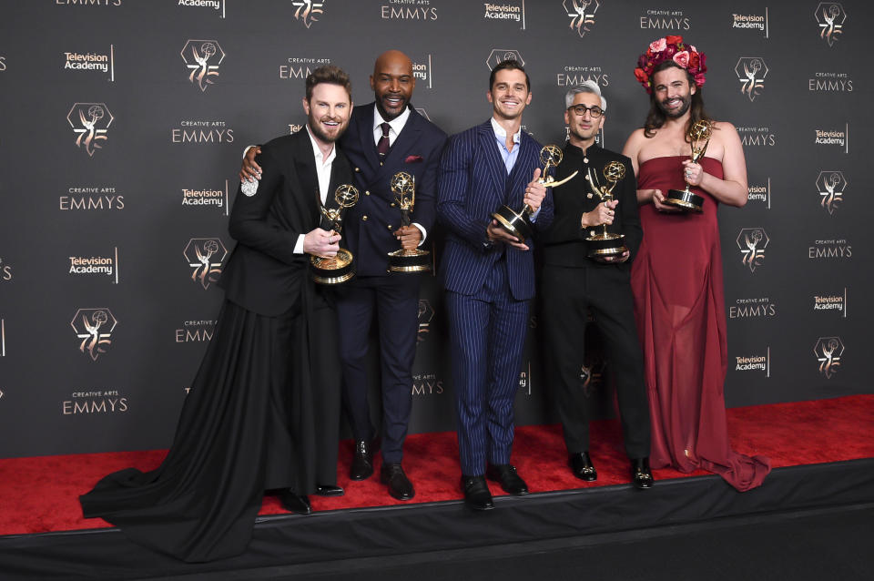 Bobby Berk, from left, Karamo Brown, Antoni Porowski, Tan France, and Jonathan Van Ness pose in the press room with the award for outstanding structured reality program for 
