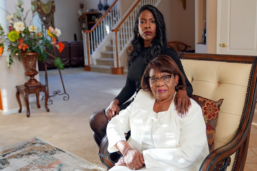 Joanne Celestin, left, sister of Samuel Celestin, and their mother, Dr. Rose Celestin, sit for a portrait in their home in Ocoee, Fla., on Monday, April 22, 2024. The county medical examiner found Samuel died from sudden cardiac arrest while he was being restrained by police, ruling his death a homicide. Florida prosecutors twice decided there was no legal basis to file charges against the responding officers. (AP Photo/John Raoux)