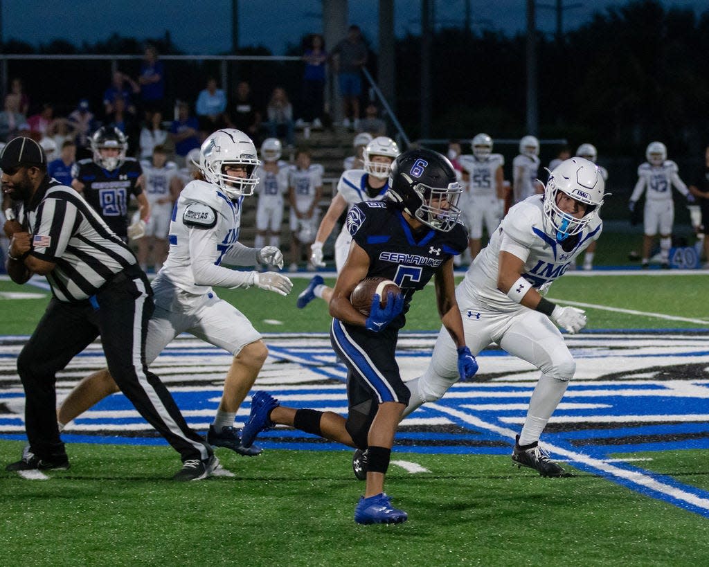 Community School of Naples defeated IMG Blue 41-13 on Thursday, Oct. 19. CSN's Noah Cardoza gains yards.