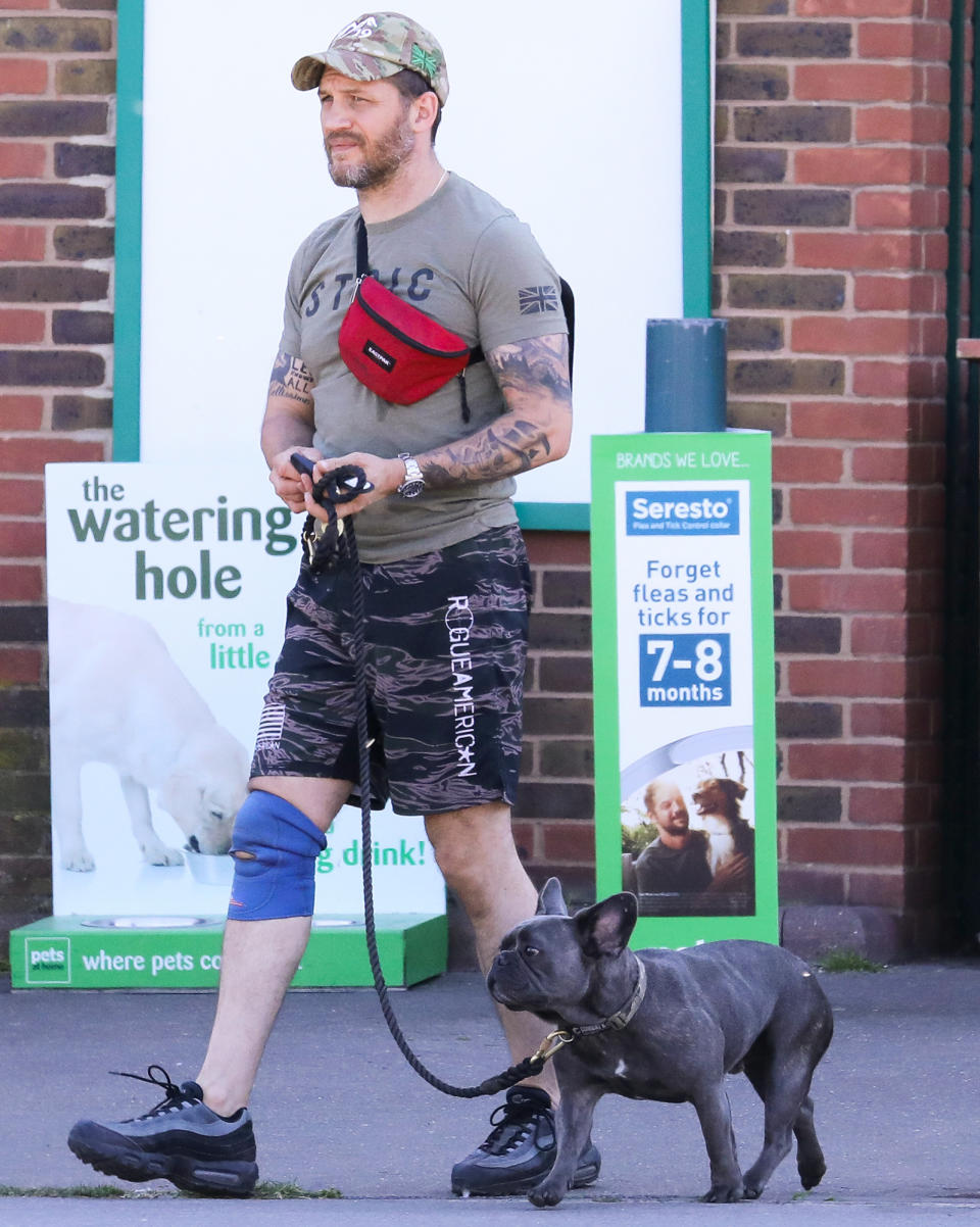 <p>Tom Hardy leads the way on Wednesday during a walk with his dog in London.</p>