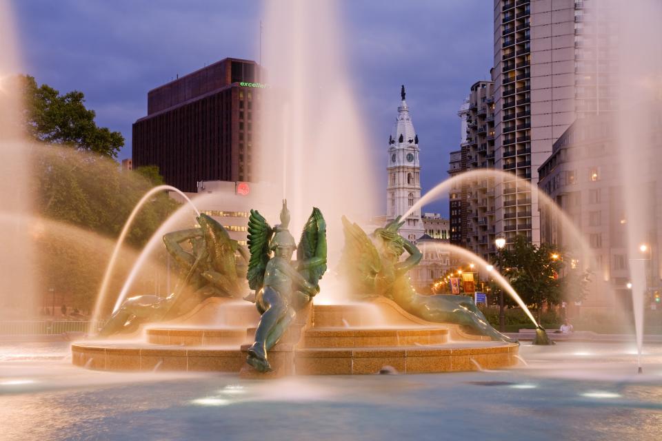 Philadelphia’s Swann Memorial Fountain by Alexander Calder’s father, with a sculpture of William Penn atop City Hall by his grandfather, in the background.