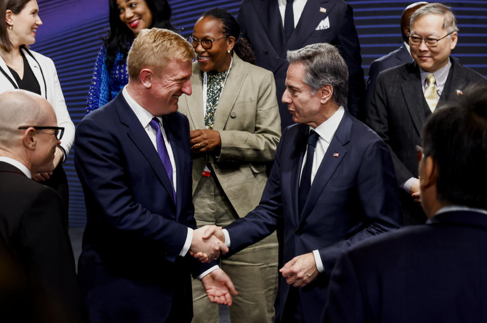 U.S. Secretary of State Antony Blinken, right, shakes hands with Britain's Deputy Prime Minister Oliver Dowden during a photo session at the third Summit for Democracy in Seoul, South Korea, March 18, 2024. (Evelyn Hockstein/Pool Photo via AP)