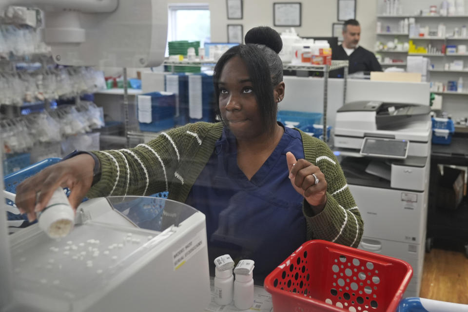 Kimberley Griffin, pharmacy technician at MAC Pharmacy, fills an order Wednesday, May 29, 2024, in Cleveland. The pharmacy is the only one serving about 20,000 people in a majority Black ZIP code in Cleveland. (AP Photo/Sue Ogrocki)