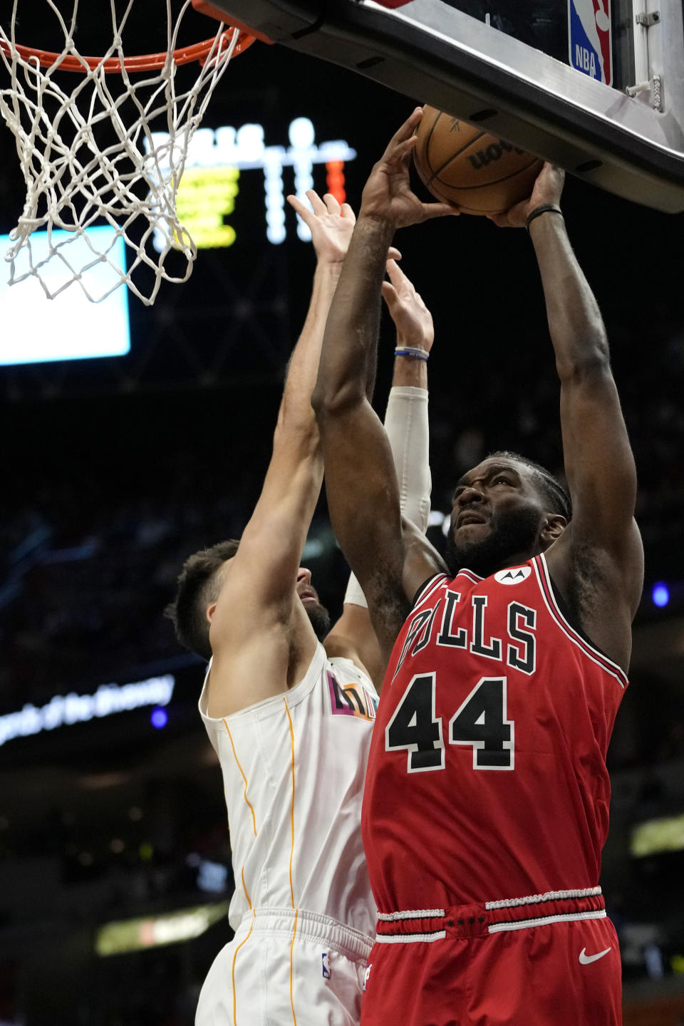 Chicago Bulls forward Patrick Williams (44) goes to the basket as Miami Heat guard Max Strus, left, defends during the first half of an NBA basketball game, Tuesday, Dec. 20, 2022, in Miami. (AP Photo/Lynne Sladky)