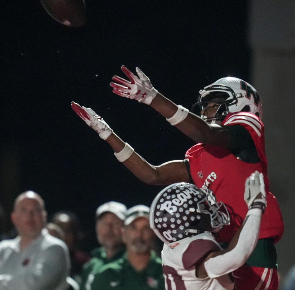 Lawrence North Wildcats wide receiver Davion Chandler (8) makes a catch in the end zone as he’s tackled by Lawrence Central Bears Nick Johnson (10) during the game between Lawrence Central Bears and Lawrence North Wildcats Friday, Oct. 27, 2023, at Lawrence North High School in Indianapolis. Wildcats were up 21-10 at the half.