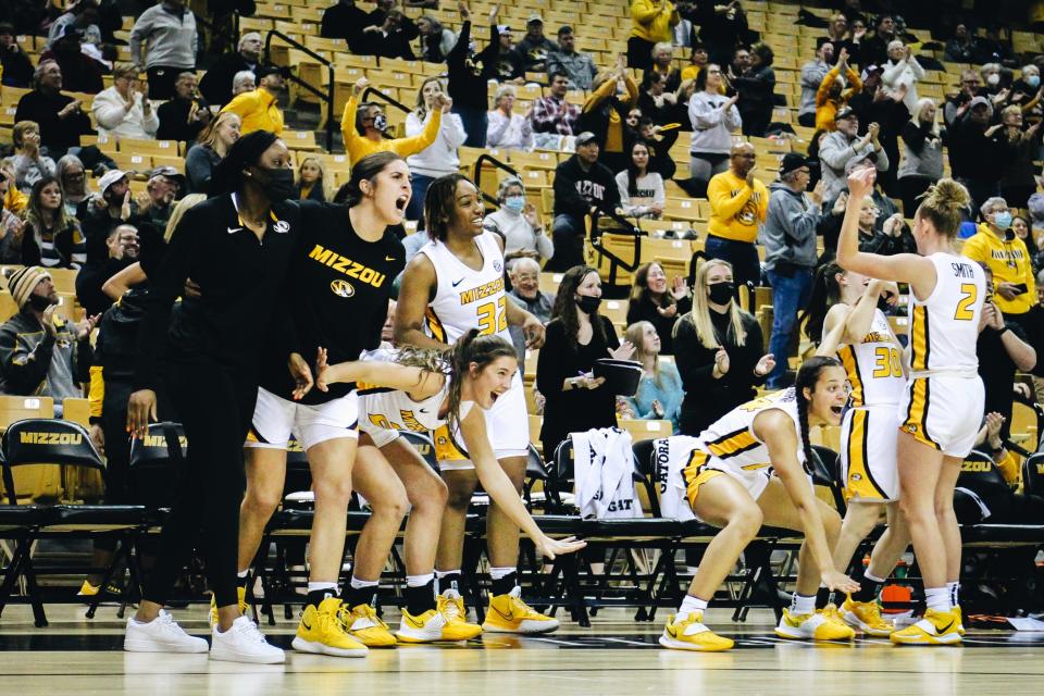 The Missouri bench celebrates after a basket in the second half against Auburn on Thursday at Mizzou Arena. The Tigers' reserves scored 13 points compared to Auburn's two.