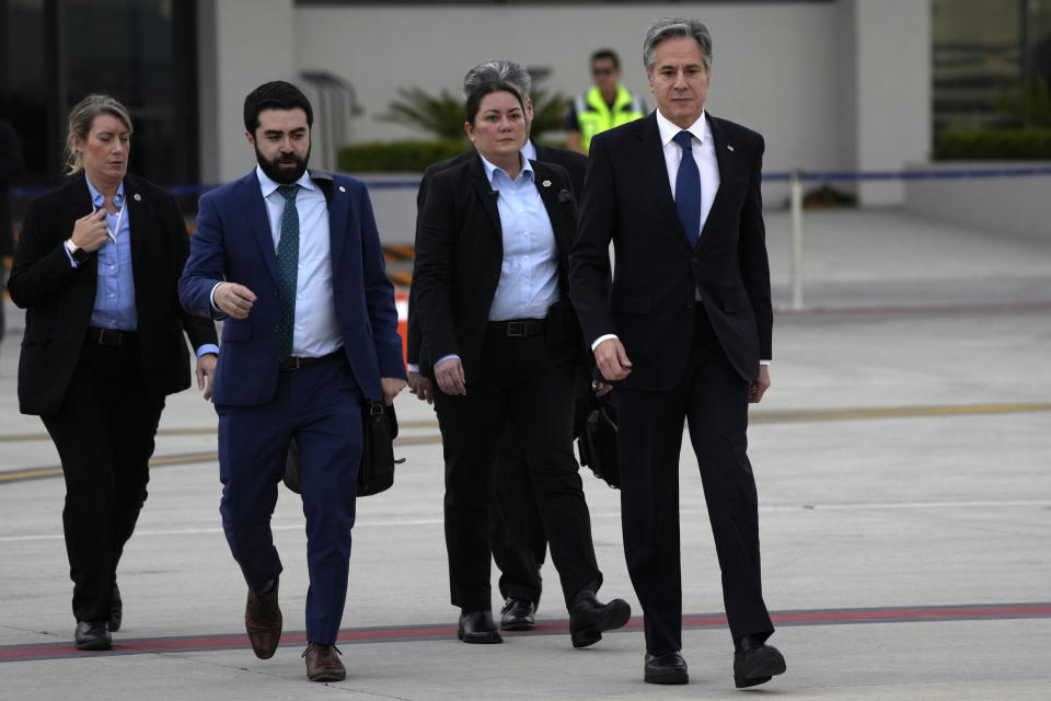 U.S. Secretary of State Antony Blinken, right, walks toward his plane, at the Felipe Ángeles International Airport (AIFA) in Zumpango, on the outskirts of Mexico City, Wednesday, Dec. 27, 2023. (AP Photo/Fernando Llano)