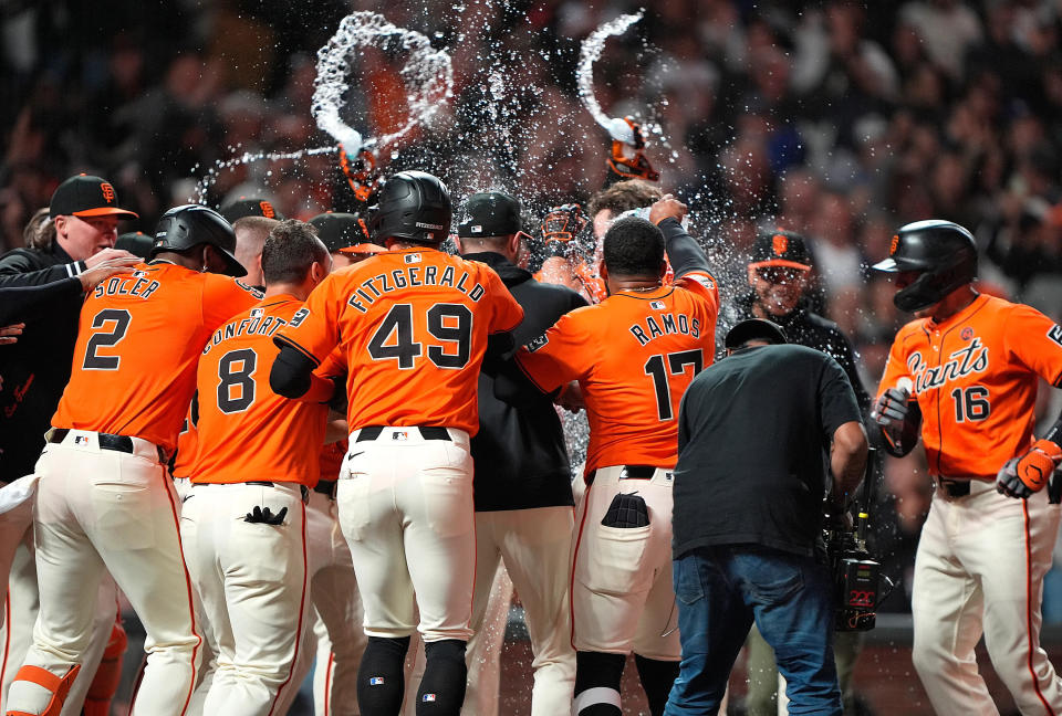 SAN FRANCISCO, CALIFORNIA - JUNE 28: Brett Wisely #0 of the San Francisco Giants celebrates with teammates after hitting a two-run walk-off home run to beat the Los Angeles Dodgers 5-3 in the bottom of the ninth inning at Oracle Park on June 28, 2024 in San Francisco, California. (Photo by Thearon W. Henderson/Getty Images)