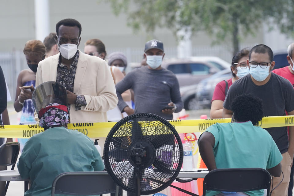 People line up to get tested for COVID-19, Monday, Aug. 9, 2021, in North Miami, Fla. Florida continues to report more cases of COVID-19 as the highly contagious delta variant is affecting mostly unvaccinated people. (AP Photo/Marta Lavandier)