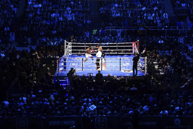 Anthony Joshua, left, and Jermaine Franklin battle during a heavyweight boxing match at The O2, Saturday, April 1, 2023 in London. (Zac Goodwin/PA via AP)