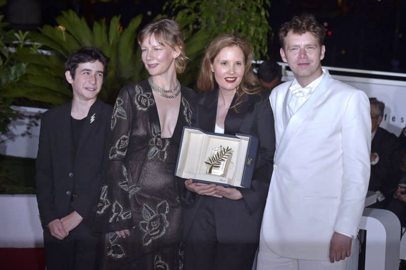 From left, Milo Machado Graner, Sandra Hüller, Director Justine Triet, and Antoine Reinartz accepted The Palme D'Or Award for "Anatomy of a Fall." File Photo by Rocco Spaziani/UPI