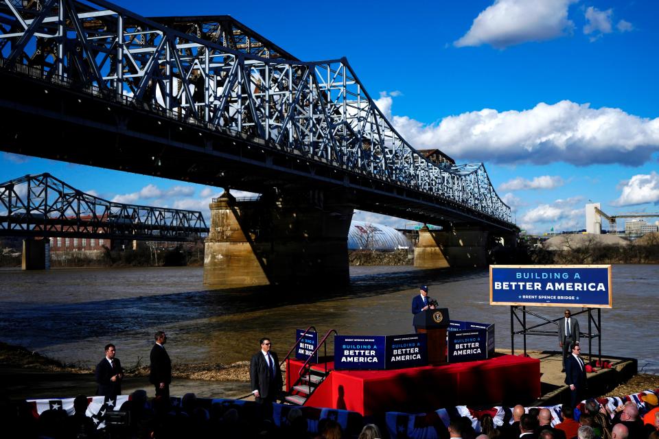 President Joe Biden touts a $1.6 billion federal investment in the long-awaited upgrade of the Brent Spence Bridge, Wednesday, Jan. 4, 2023, in Covington, Ky. The bridge spans the Ohio River connecting Ohio and Kentucky. Biden was joined by Ohio Gov. Mike DeWine, Kentucky Gov. Andy Beshear, Sen. Mitch McConnell and other state and local leaders.