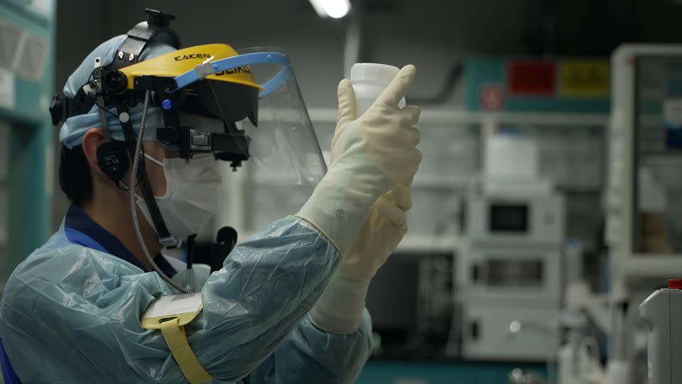 A TEPCO researcher assesses the radiation impact of treated wastewater in  Fukushima, Japan, on April 12, 2023. - Daniel Campisi/CNN