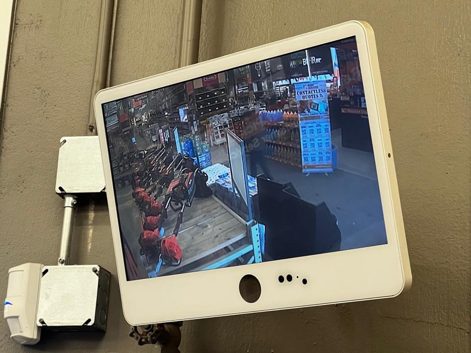 A security camera monitoring the entrance at Home Depot.